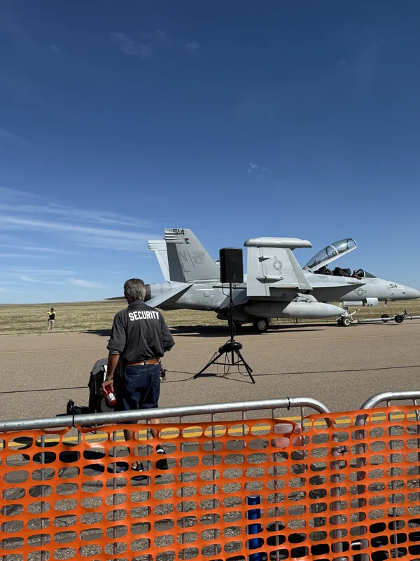 MarTech security guard at the Pueblo Airshow with an F/A-18 in the background